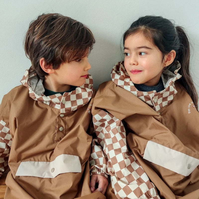 Poncho de pluie Poule Party adulte ou enfant damiers
